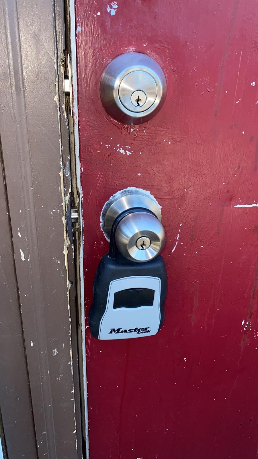 Residential door with deadbolt and lockbox